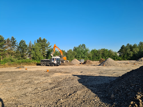 Bens Demolition Division photo Uplifting a car park that includes 20000 square metres of tarmac, kerb stones, tree protection hoarding, also crushing the aggregate on site and removing for recycling.