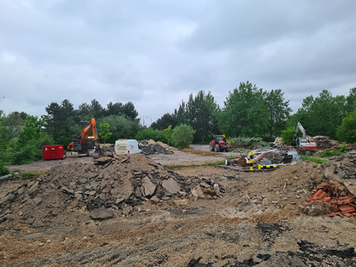Bens Demolition Division job Uplifting a car park that includes 20000 square metres of tarmac, kerb stones, tree protection hoarding, also crushing the aggregate on site and removing for recycling. photo number 10