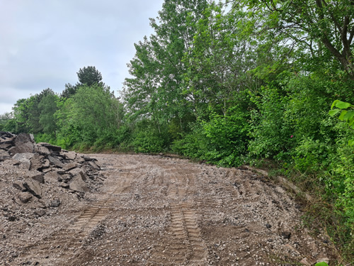 Bens Demolition Division job Uplifting a car park that includes 20000 square metres of tarmac, kerb stones, tree protection hoarding, also crushing the aggregate on site and removing for recycling. photo number 11