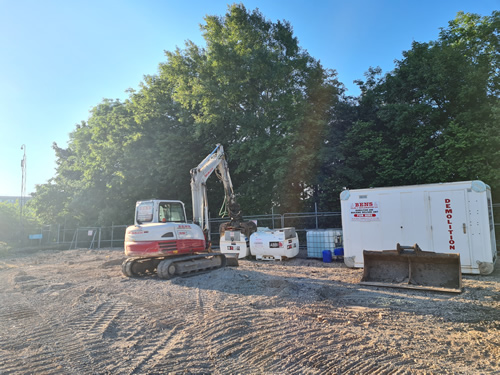 Bens Demolition Division job Uplifting a car park that includes 20000 square metres of tarmac, kerb stones, tree protection hoarding, also crushing the aggregate on site and removing for recycling. photo number 18